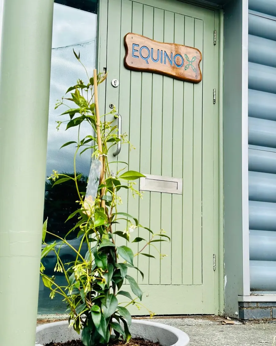 The Equinox Centre entrance, with jasmine climbing beside the door